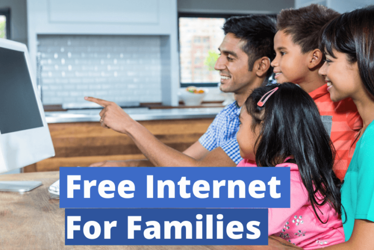 happy family using computer in the kitchen