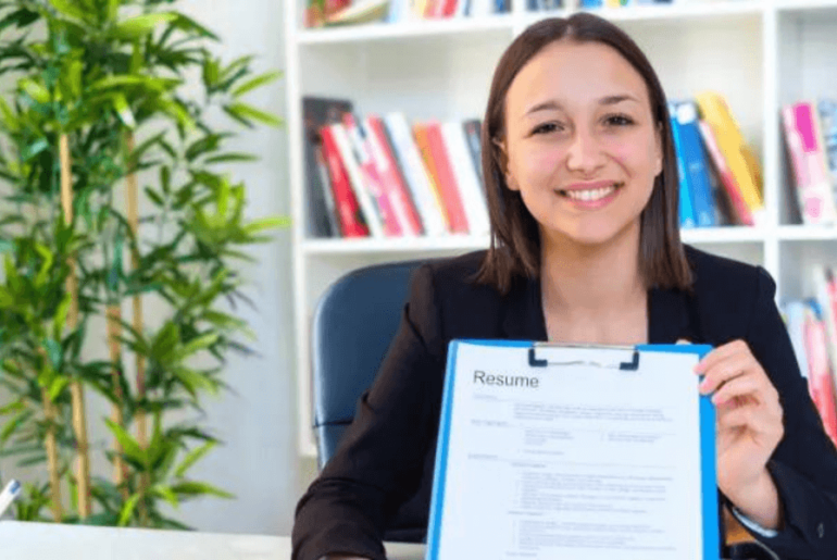 Woman holding her resume - How to create an effective resume