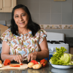 Hispanic woman cooking homemade food